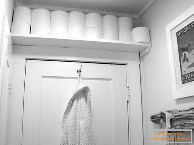 Toilet paper shelf above the door
