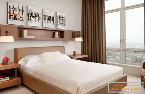 Interior of a small bedroom with a view of the city