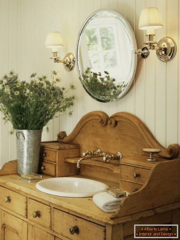 An antique chest of drawers as a cupboard for a washbasin