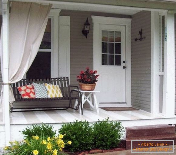 A small veranda with a bench