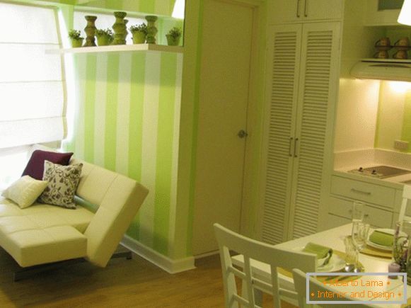 Interior of a tiny apartment in green tones
