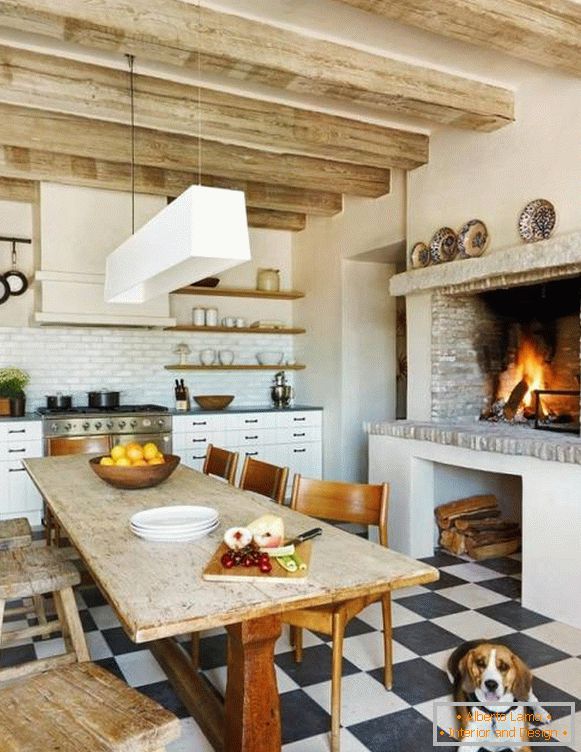 Cozy kitchen with fireplace in rustic style