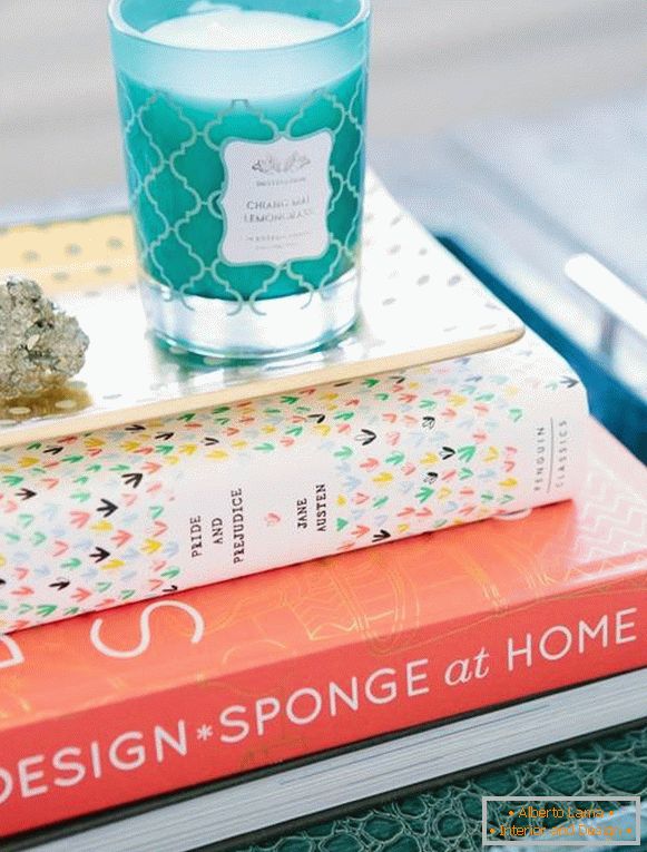 A stack of books with decor on the table