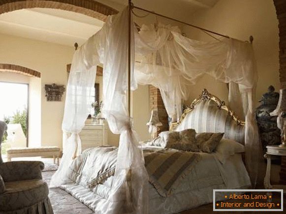 Beautiful romantic bedroom with four-poster bed