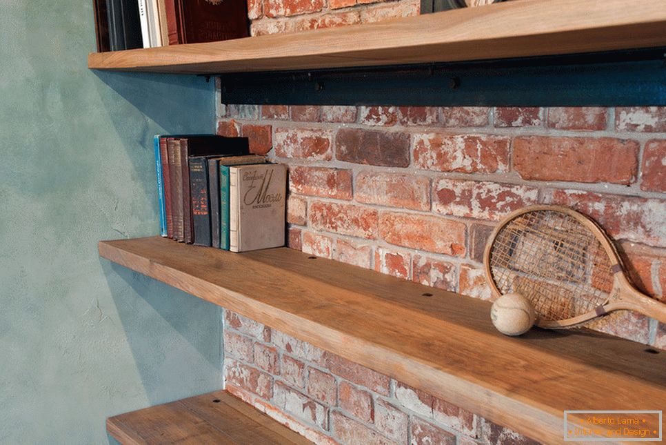 Shelves for books in an apartment in the loft style