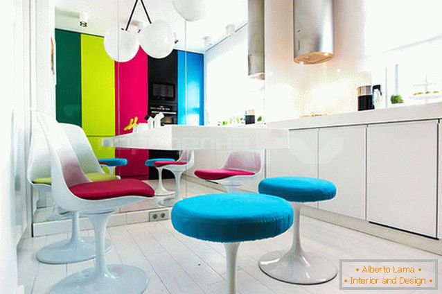 Varied colorful furniture in a white kitchen