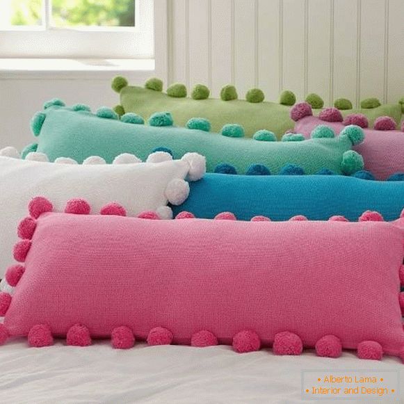 Decoration of pillows with pom-poms