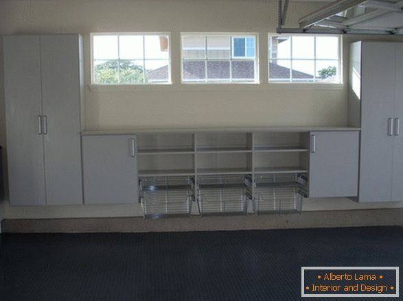 Baskets and cabinets on the wall in the garage