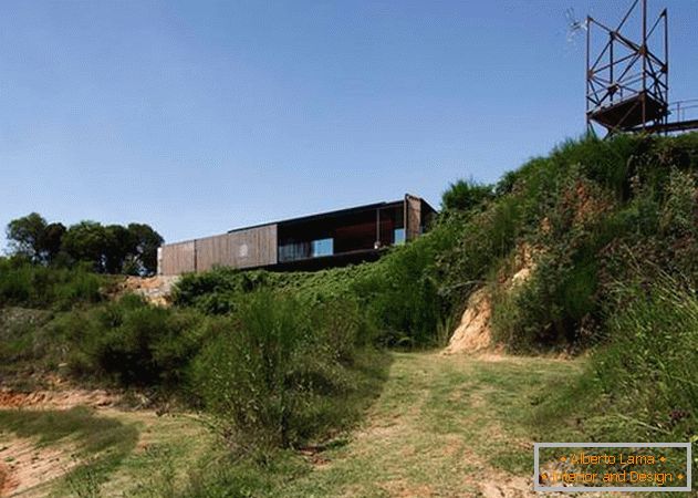 Inexpensive house of concrete blocks. Former building of sawmill