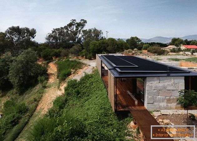 Inexpensive house of concrete blocks on a slope