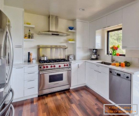 White corner kitchen - photo in the interior with a wooden floor
