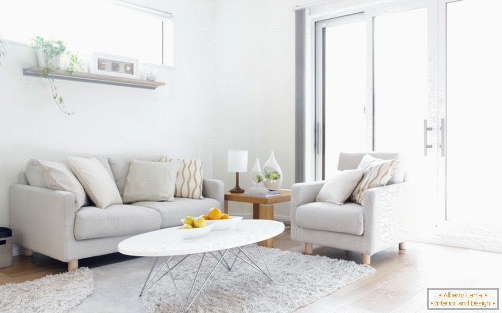 Light furniture and a table in the interior of the living room