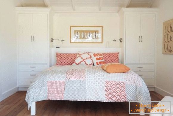 White bedroom furniture with red and beige decor