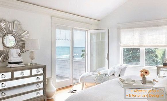 Luxurious white bedroom in the interior of the house