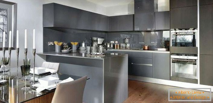 Style minimalism in the interior of a large kitchen. The working area is gray.