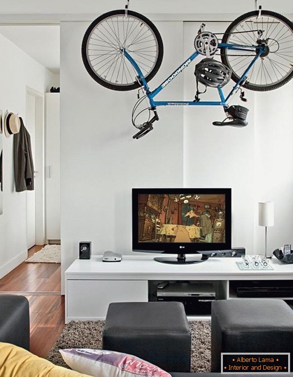 Bicycle suspended from the ceiling on brackets
