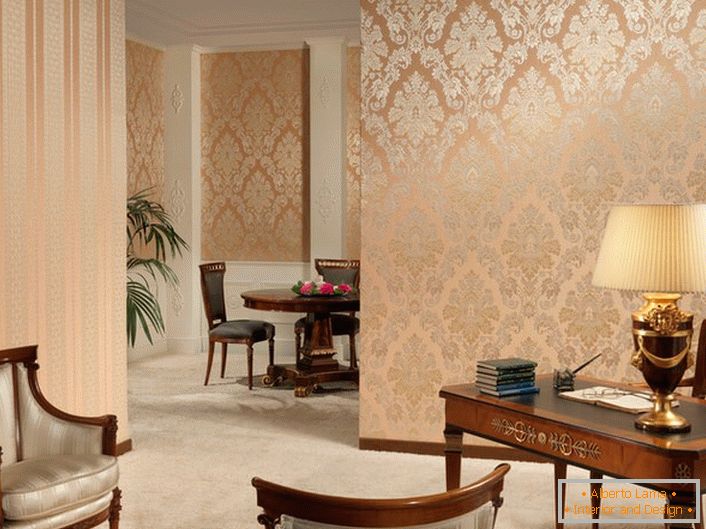 A strict strip and ornate patterns of gold color, on a delicate peach wallpaper in a baroque-style office.