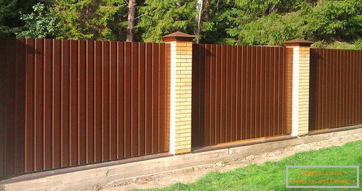 Modular fence around the hunting lodge in the forest. 