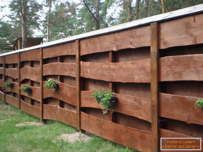 Modular fence made of wood for a house in the style of a chalet. 