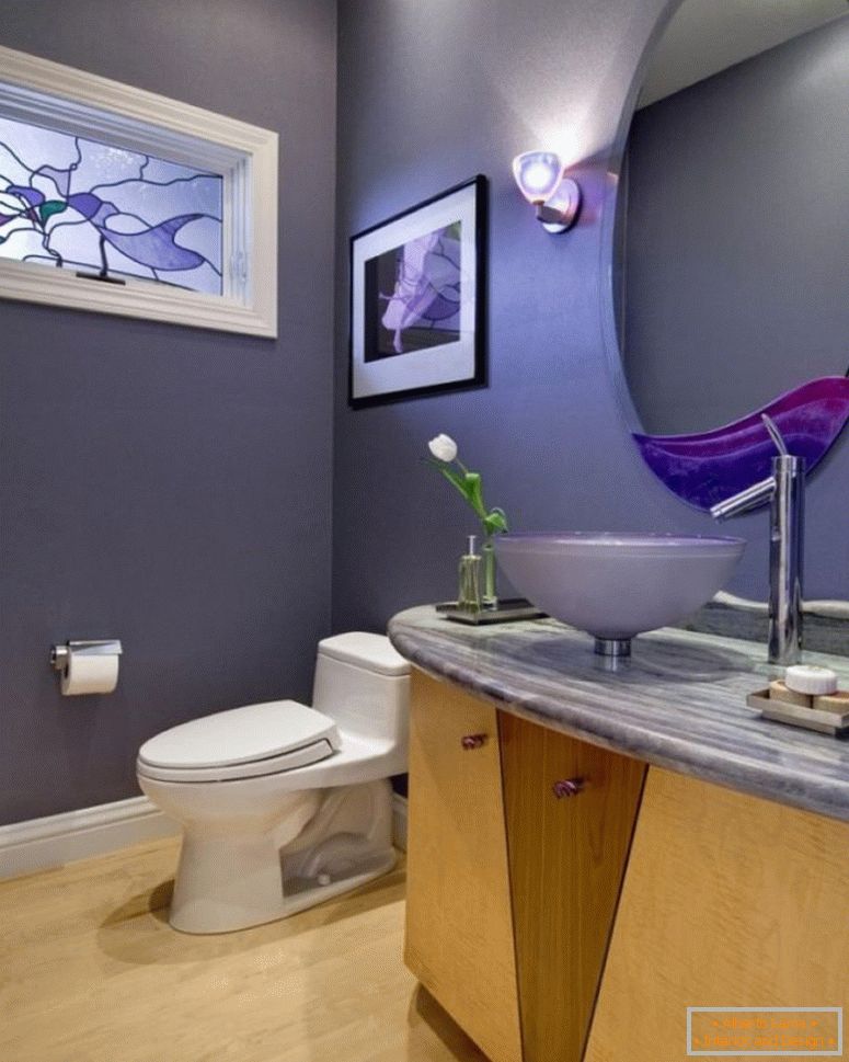 exotic-grey-powder-room-idea-with-white-toilet-plus-acrylic-basin-plus-round-mirror-near-wall-lamps