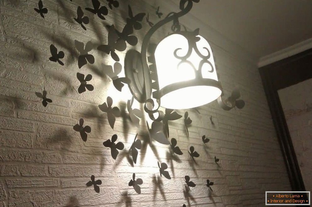 Butterflies on the wall with a lamp