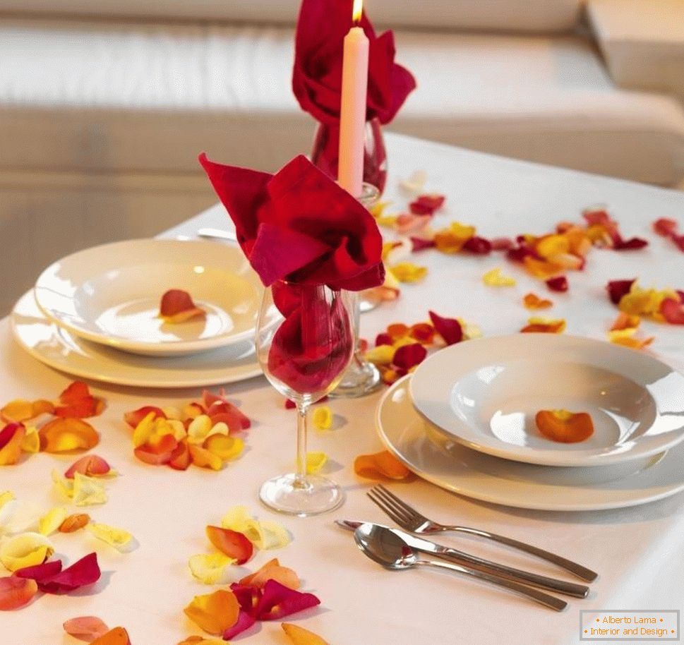 Simple decoration of the table with rose petals