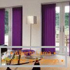 The combination of light walls and lavender blinds