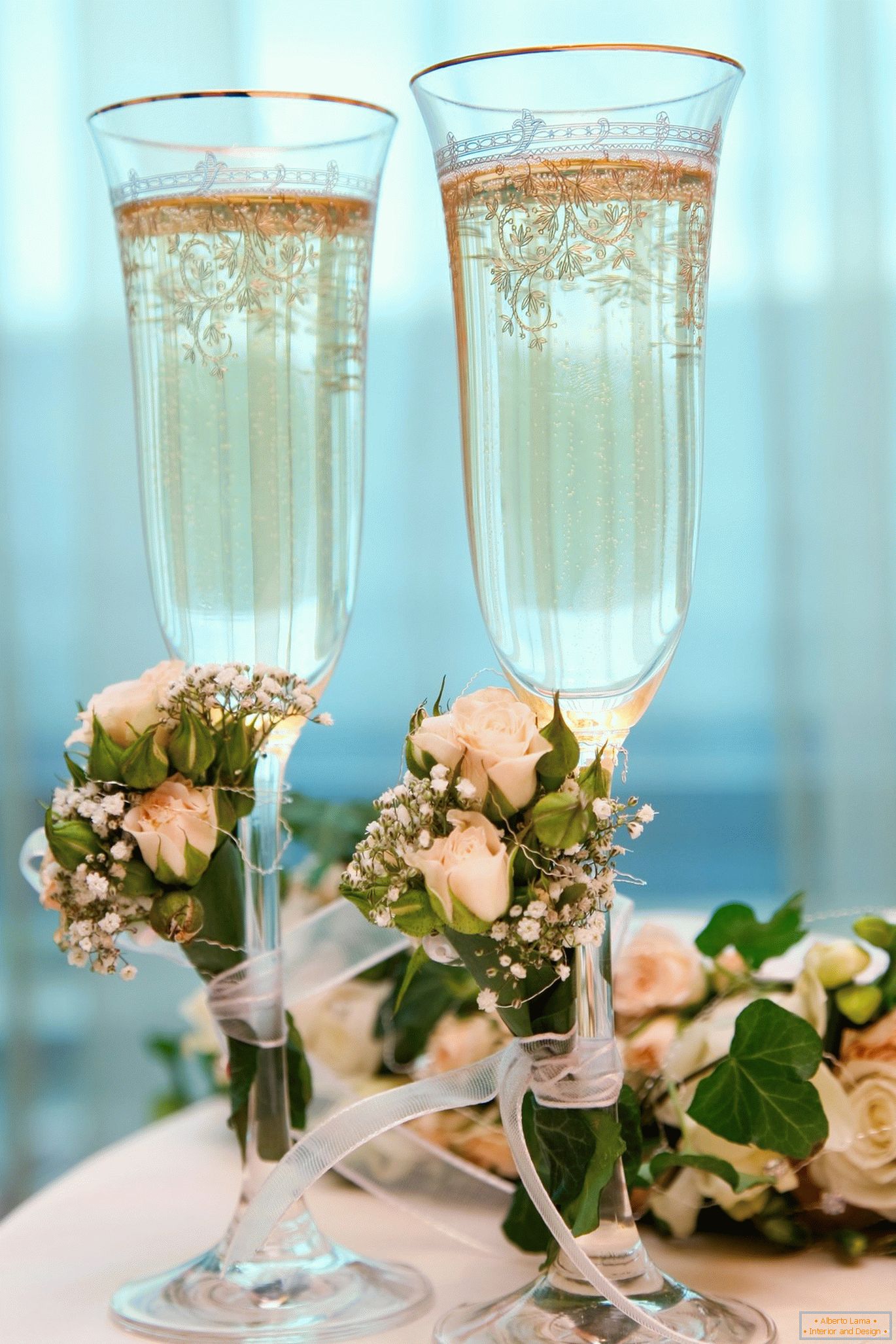 Wedding glasses with artificial flowers