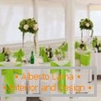 Green bows on white chairs