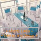 White and blue tablecloths and chair covers