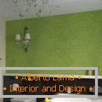 Green wall in the design of the room