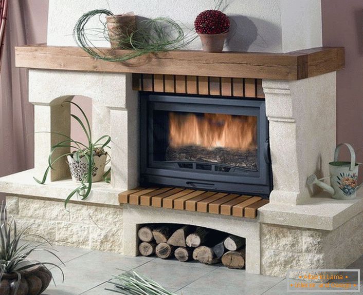 Gas fireplace with a portal and a chimney from a natural stone.
