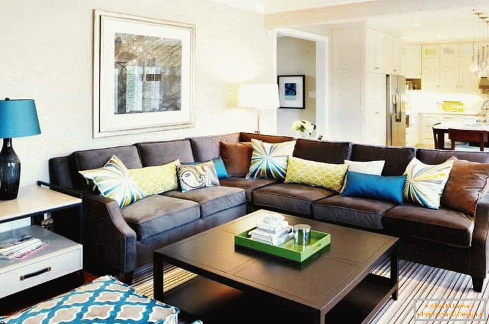 Bright cushions on a brown sofa