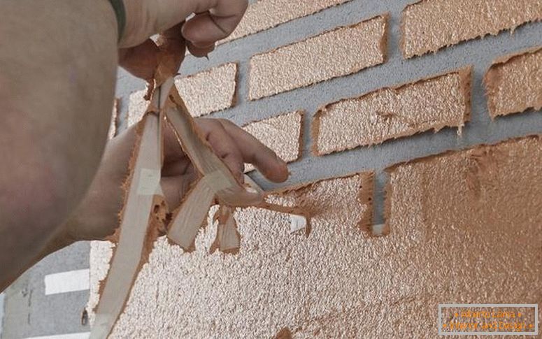 Relief of brickwork with plaster and paint tape