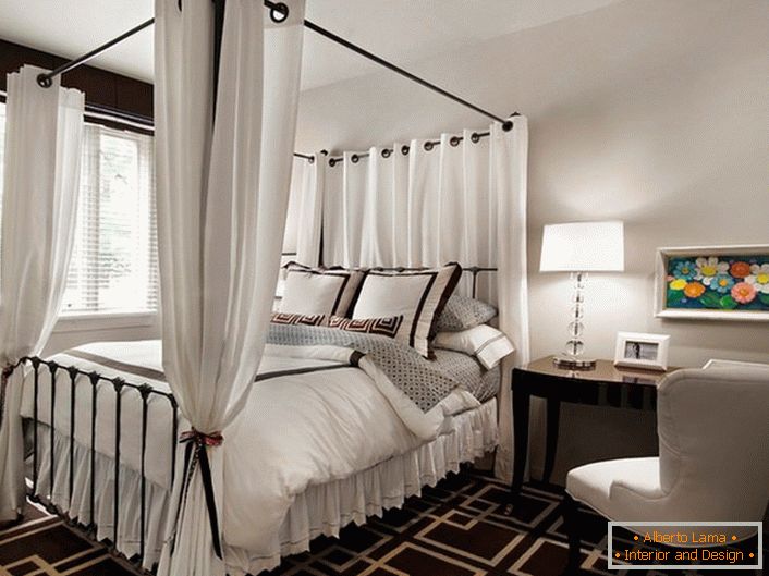 A metal bed with a canopy in a country house in the suburbs. 