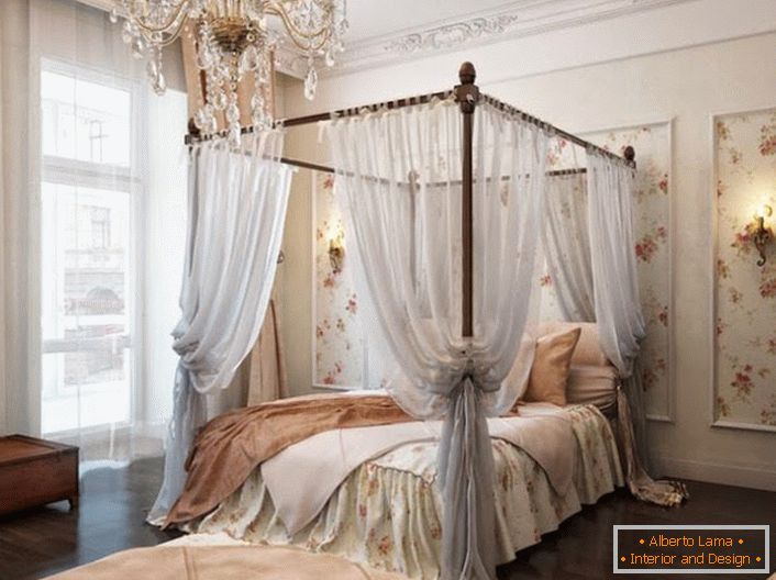 The bedroom in the Baroque style is decorated with an elegant, air canopy that makes the rest even more relaxing. 