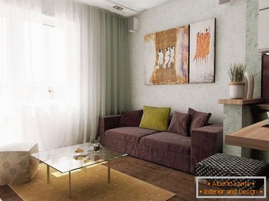 Soft sofa in the kitchen with a bed in the apartment interior