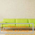 Interior in a minimalist style with a light green sofa