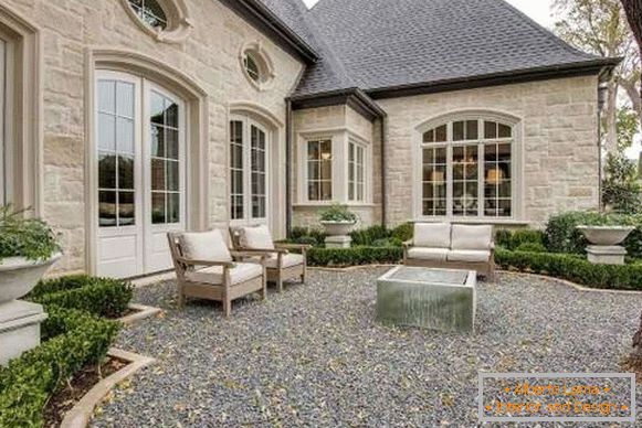 Fireplace on the site of a private house - a photo of the design of the courtyard of a private house