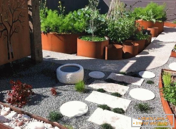 Unusual yard design in a private house in a village in a modern style