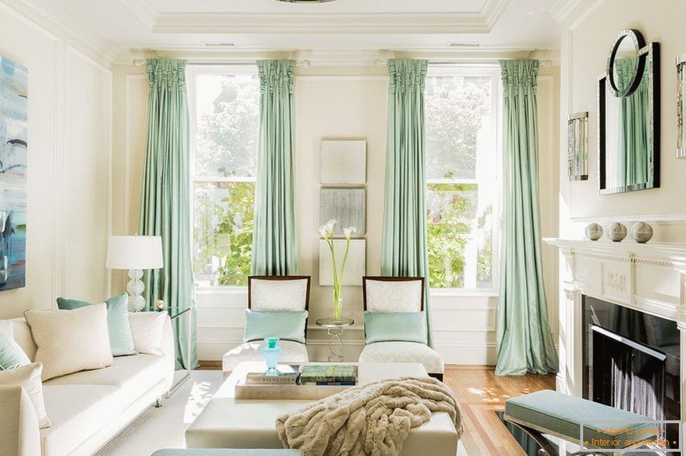 Bright living room with two windows to the ceiling