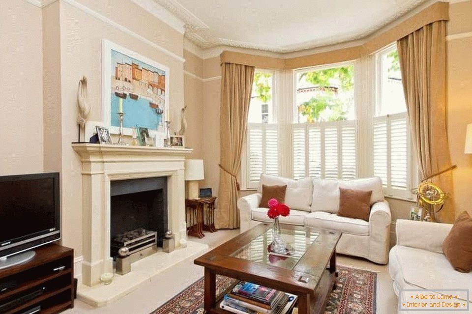 Fireplace in living room with bay window
