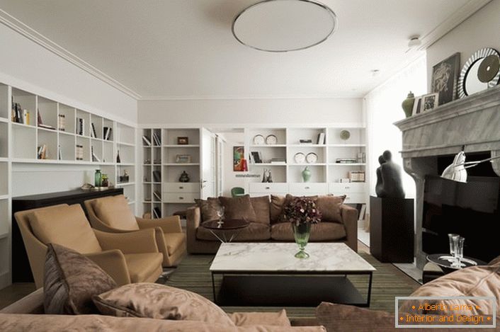 The walls of the room and its ceiling are made in white, which makes the living room more spacious and bright.