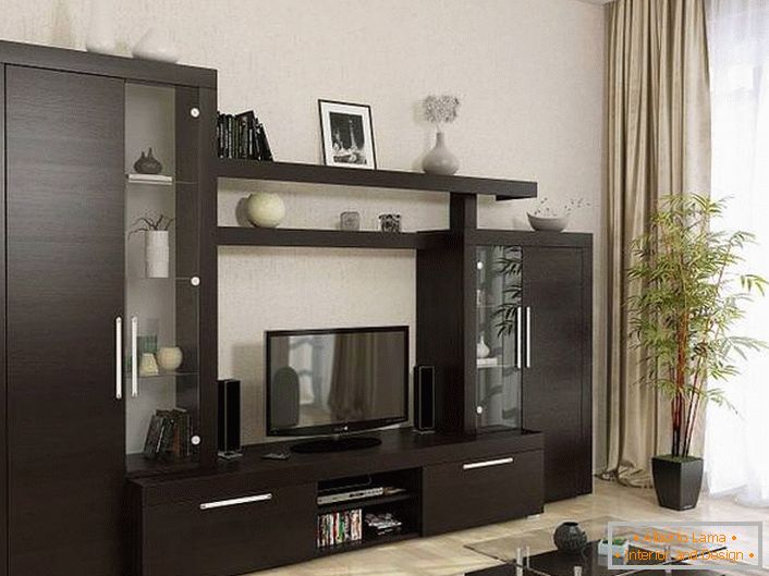 The living room furniture is matched in wenge color. Restrained design with decorative laconic details looks presentable.