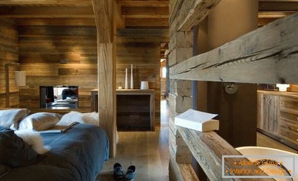 Interior design of a country house in chalet style - bedroom and bathroom