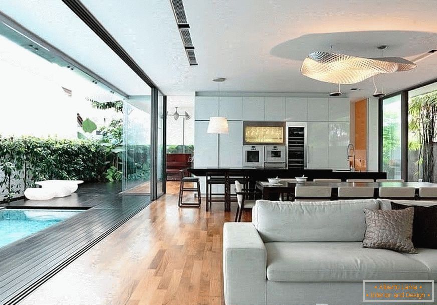Design kitchen-dining room-living room with a wall entirely of glass