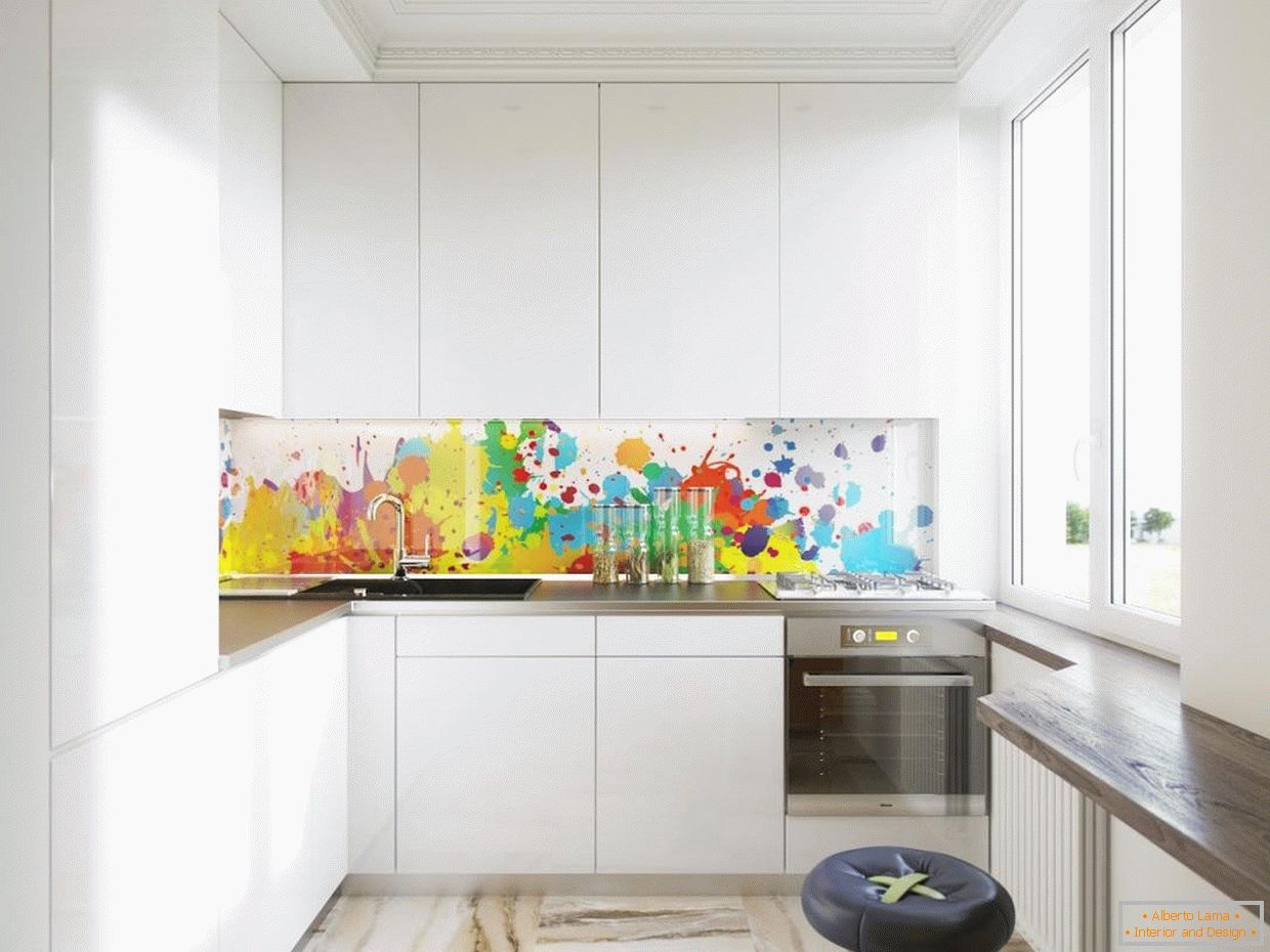 A colored glass apron in a white kitchen