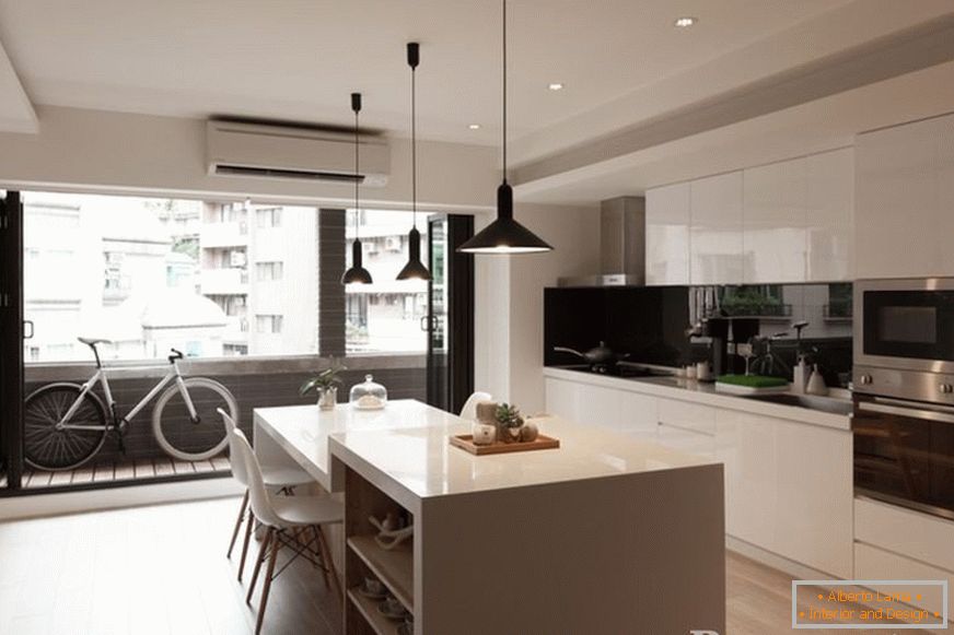 Interior of modern kitchen with balcony