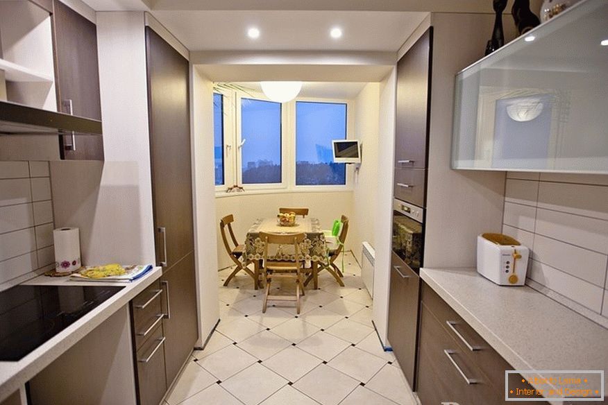 Narrow and long kitchen with attached balcony