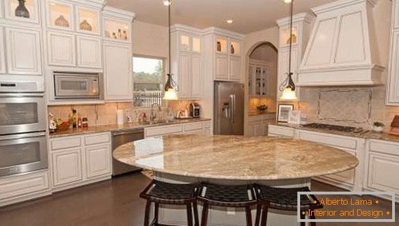 Design of kitchen with a dining room in the form of an island in a private house - photo